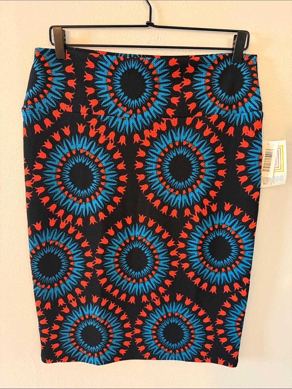 LuLaRoe Black Skirt with Blue & Red Sunburst Motif